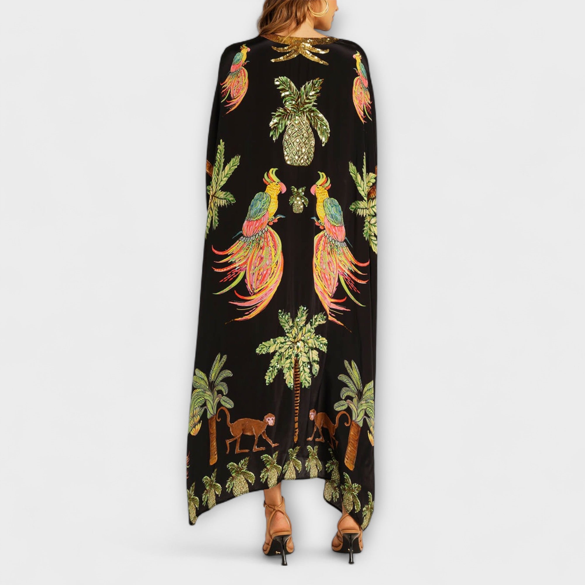 Linda - Impresionante vestido con tirantes asimétricos y estampado de palmeras